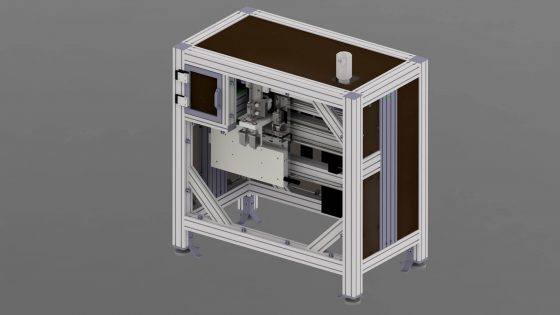 Prüfstation mit transparenter Abdeckung und mechanischen Komponenten.